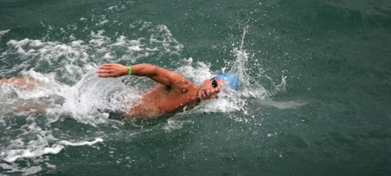Alex Kostich winning his 10th Pier to Pier Swim. Photo by Ray Vidal