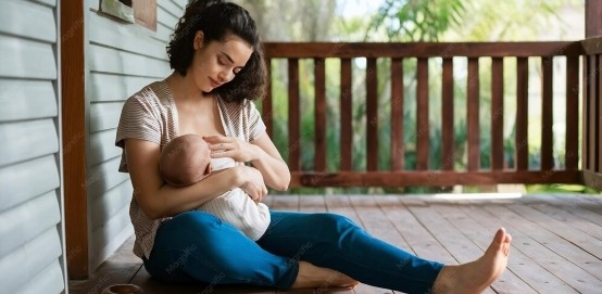 Mother breastfeeding on Porch Mother breastfeeding on Porch